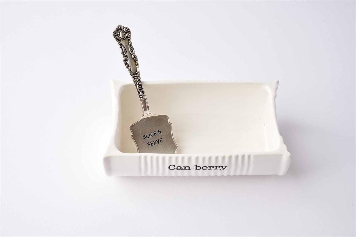 Ceramiic white dish for cranberry sauce Decorative knife with 'Slice Serve' tag on a white surface
