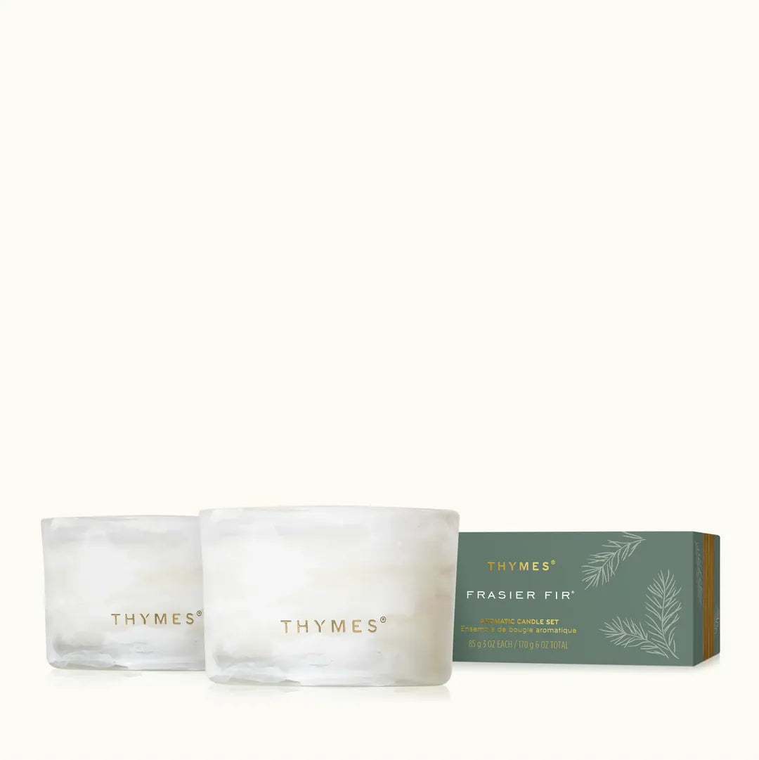 Thymes Frasier Fir Tidings Boxed Votive Candle Gift Set featuring two 3 oz scented candles with fresh Siberian fir, cedarwood and sandalwood fragrance.