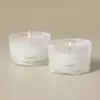 Thymes Frasier Fir Tidings Boxed Votive Candle Gift Set featuring two 3 oz scented candles with fresh Siberian fir, cedarwood and sandalwood fragrance.