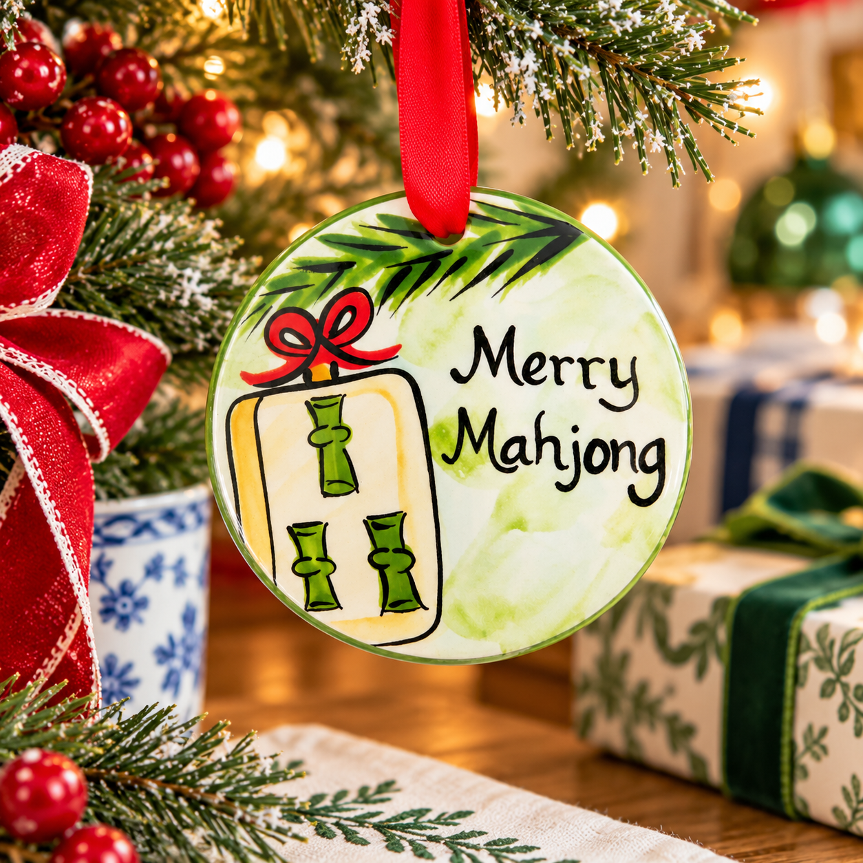 Christmas ornament with 'Merry Mahjong' text and decorative elements on a wooden surface.