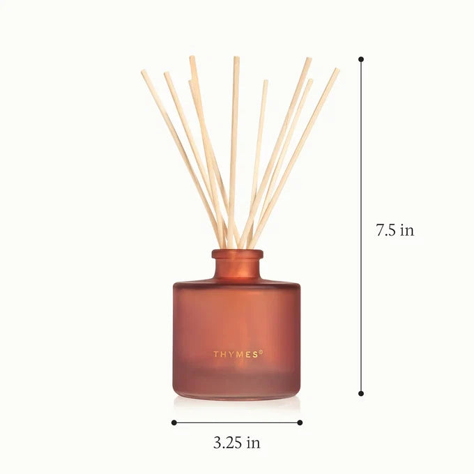 A reed diffuser bottle in frosted amber-brown glass with light natural reeds, shown on a white background with dimension markers indicating 7.5 in height and 3.