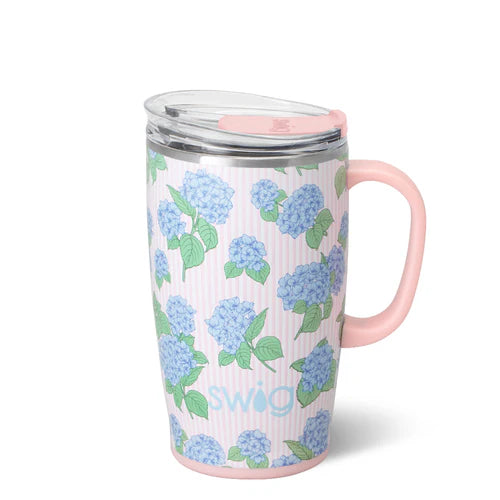 Swig Hydrangeas Travel Mug 18oz featuring soft blue hydrangea clusters on a blush and white pinstripe background with handle and EZ Slider lid
