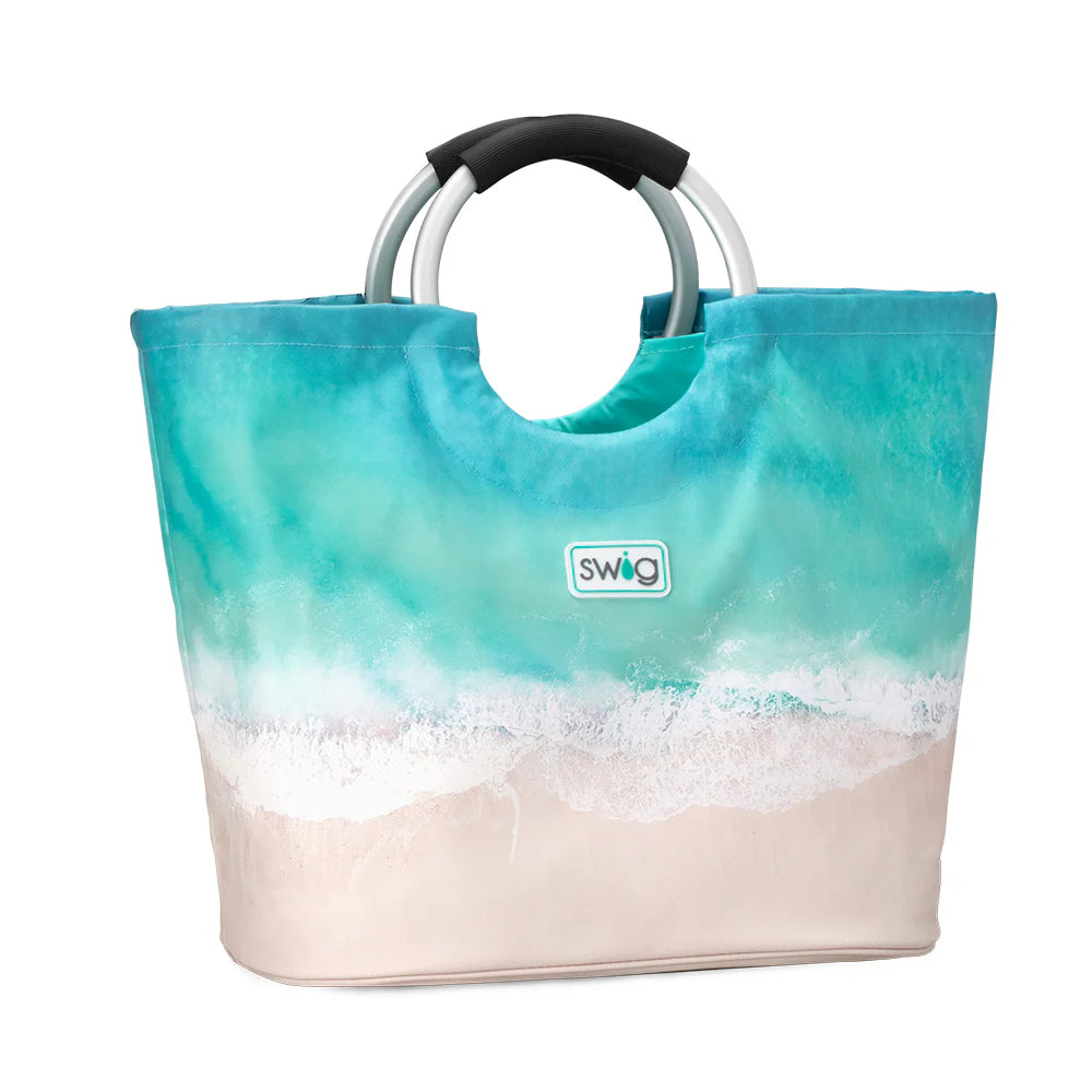Swig High Tide Loopi Tote Bag featuring crashing waves on warm sandy beaches with cushioned aluminum loop handles
