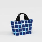 SCOUT Nooner Lunch Bag insulated lunch tote shown in a structured rectangular design with top handle and zip closure, styled as a compact everyday food carrier