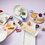 Nora Fleming mini holiday decoration on serving platter