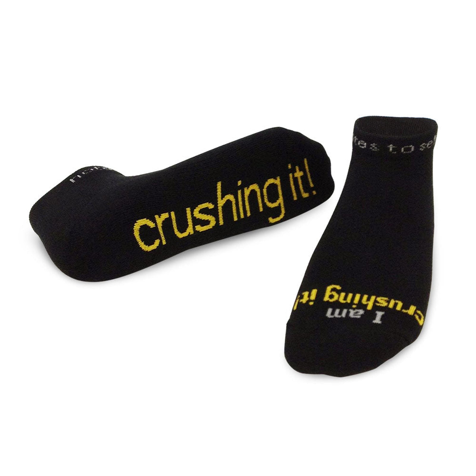 I am Crushing It affirmation socks, black low-cut with yellow words